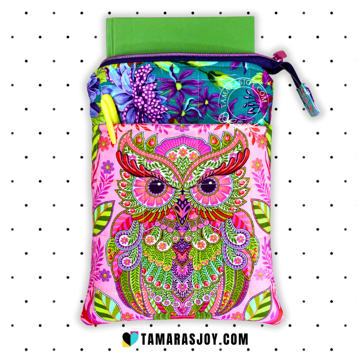 Colorful owl-patterned book pouch with a zipper on a white background